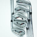 Five PING iron golf clubs arranged in a fan shape on a clean white background, showing the clubheads and part of the shafts.