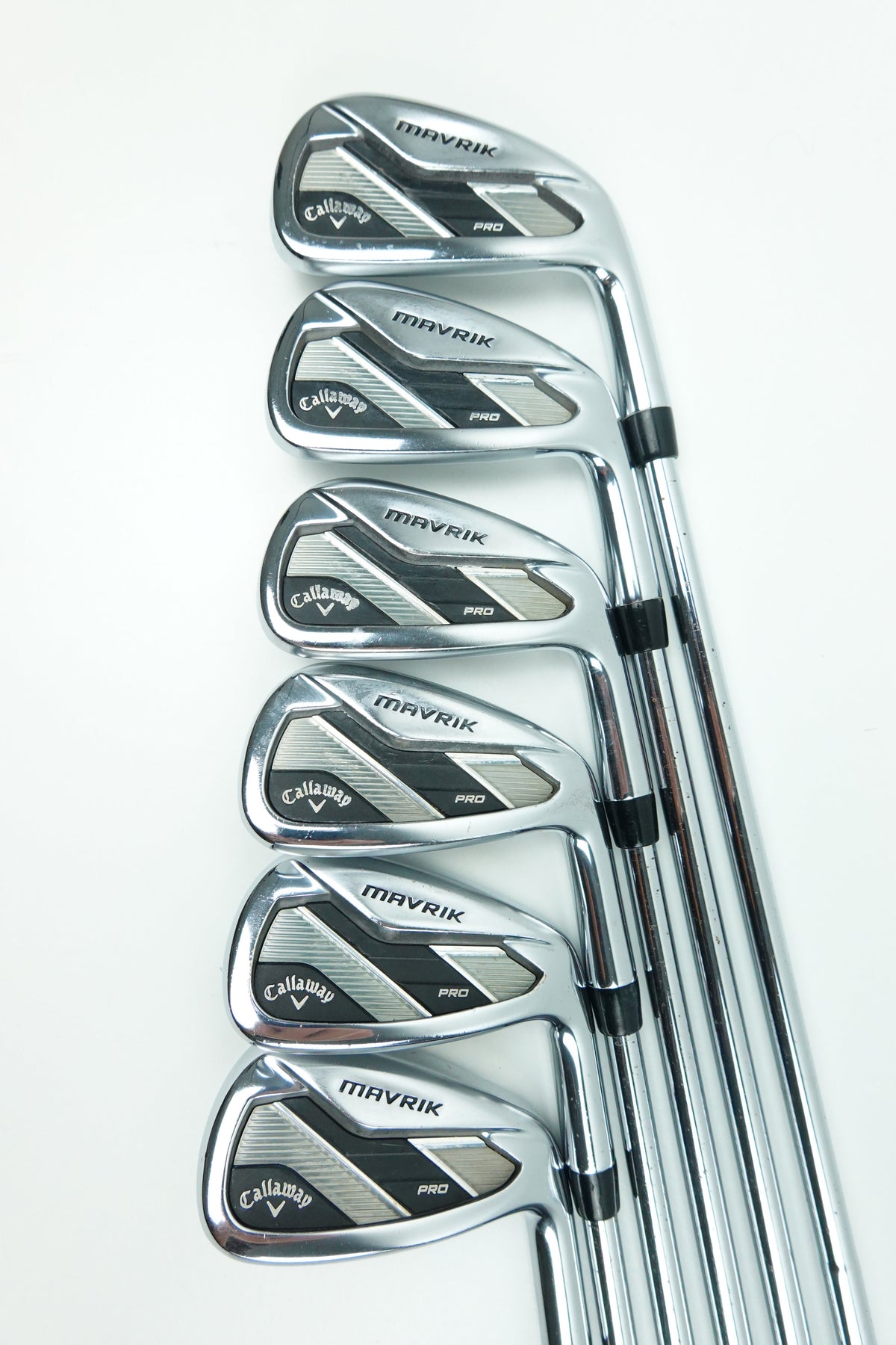 Six Callaway M-Vector iron golf clubs arranged in a fan shape on a clean white background.