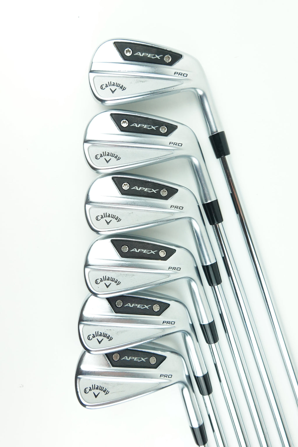 A set of seven Callaway Apex iron golf clubs arranged in a fan shape on a clean white background.