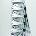 Six TaylorMade golf iron clubs arranged in a fan shape on a clean white background.