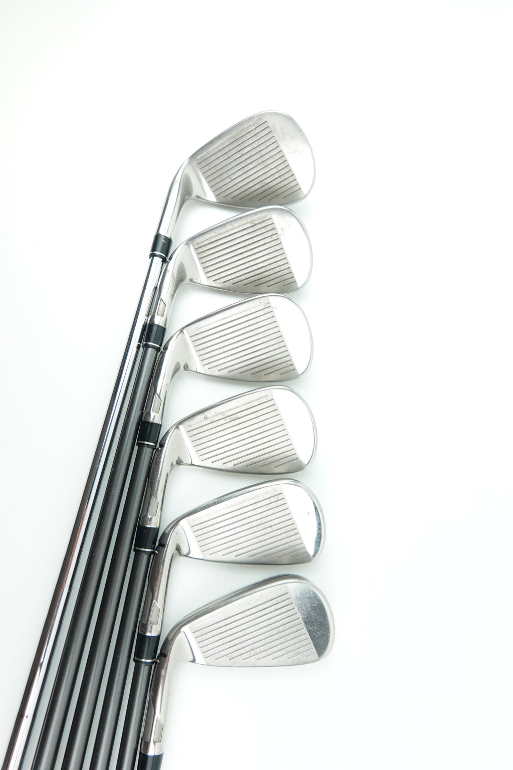 A set of seven golf iron clubs arranged in a fan shape on a plain white background.
